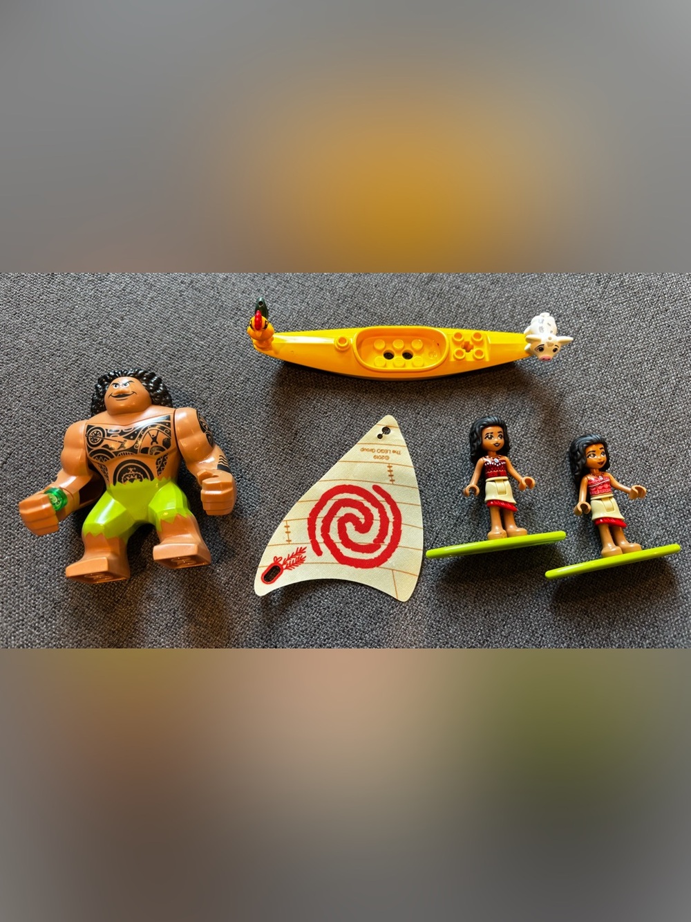 Lego mini figures Moana, Maui, Pua, and Hei Hei